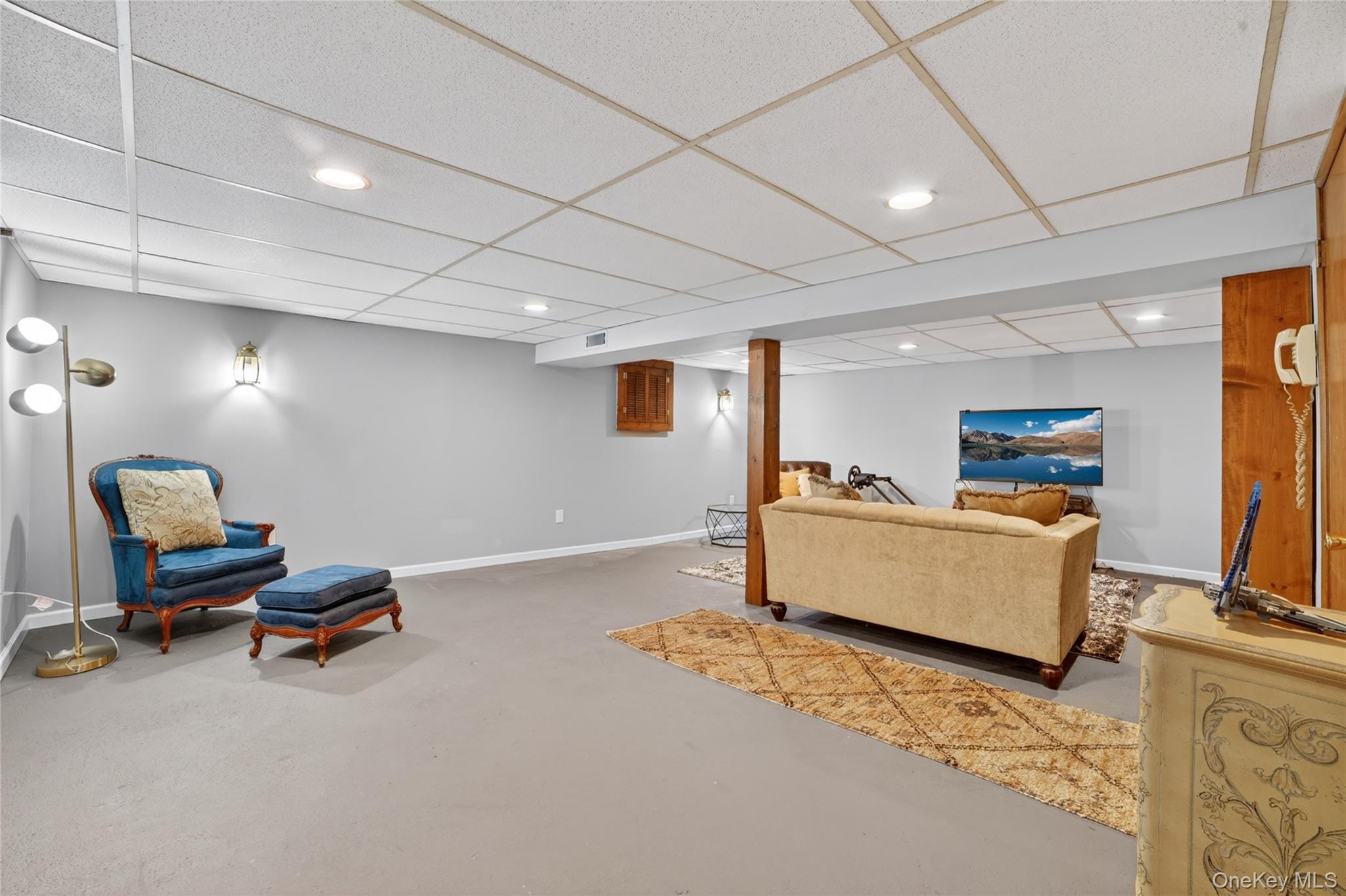 29 Newkirk Road Yonkers, NY 10710 - Photo 19 of 34 a living room with furniture and a flat screen tv