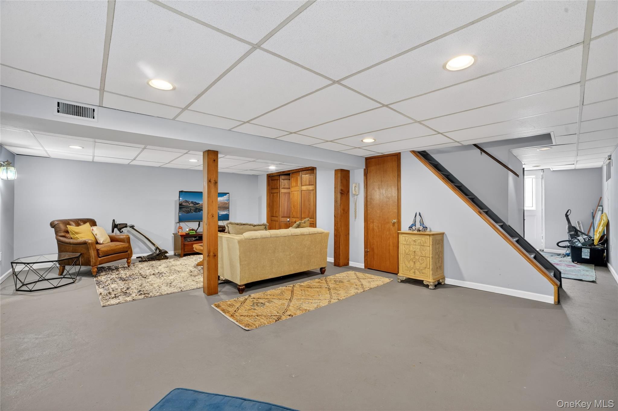 29 Newkirk Road Yonkers, NY 10710 - Photo 20 of 34 a living room with furniture and a flat screen tv