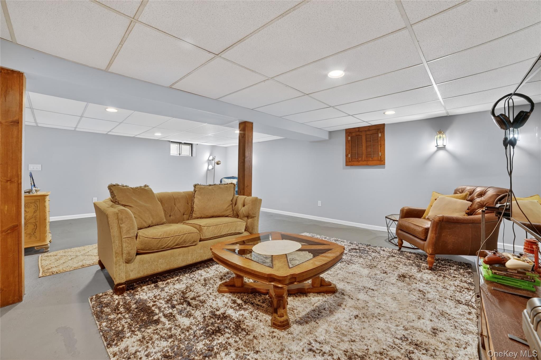 29 Newkirk Road Yonkers, NY 10710 - Photo 22 of 34 a living room with furniture a rug and a table