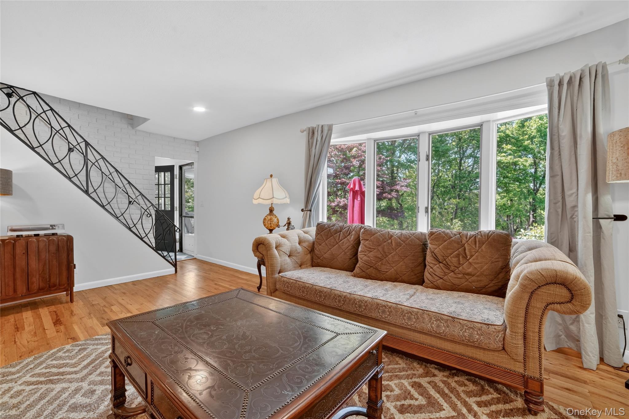29 Newkirk Road Yonkers, NY 10710 - Photo 4 of 34 a living room with furniture and a large window
