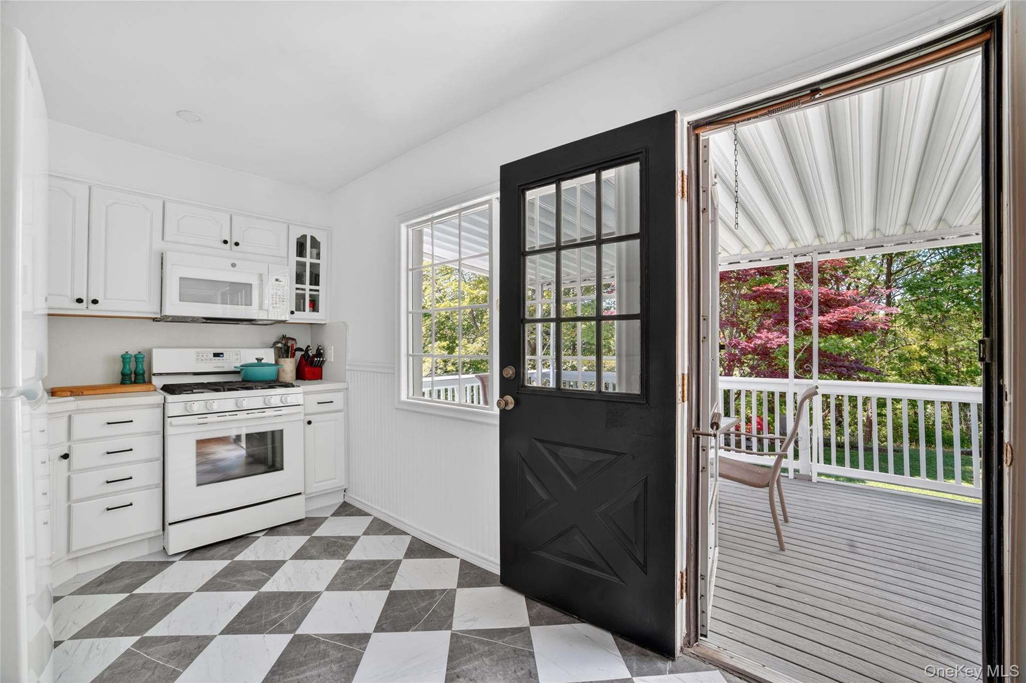 29 Newkirk Road Yonkers, NY 10710 - Photo 9 of 34 a kitchen with a stove a sink and a window