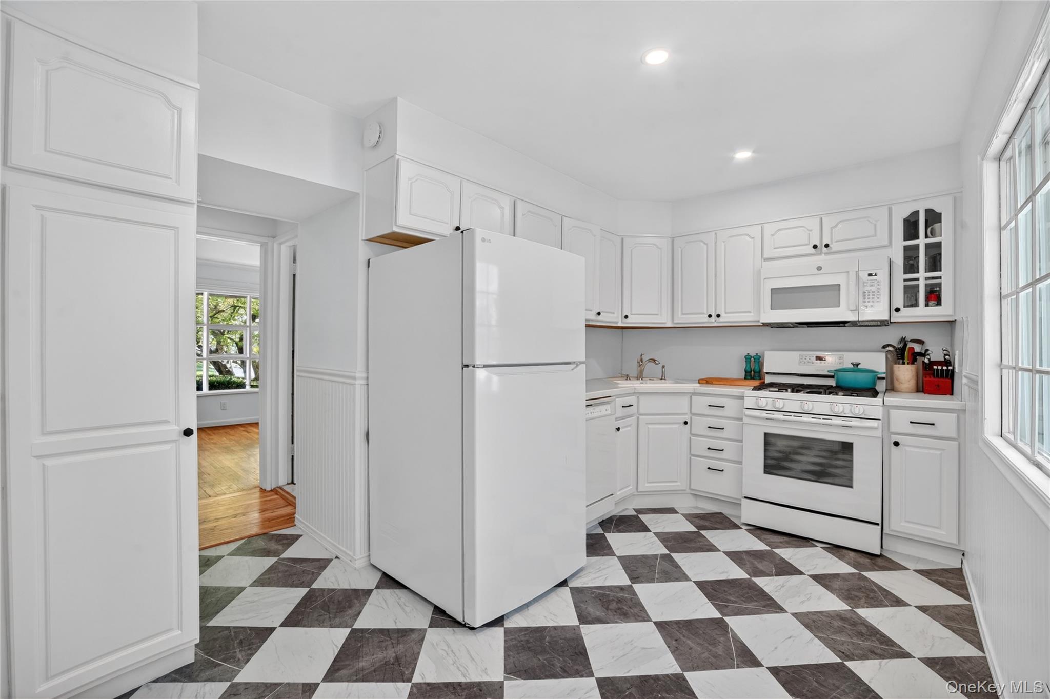 29 Newkirk Road Yonkers, NY 10710 - Photo 10 of 34 a kitchen with a stove a refrigerator and a sink