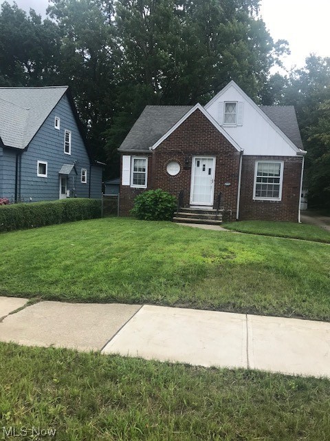 1697 Oakmount Road South Euclid, OH 44121 - Photo 1 of 10 View of front facade with a front lawn