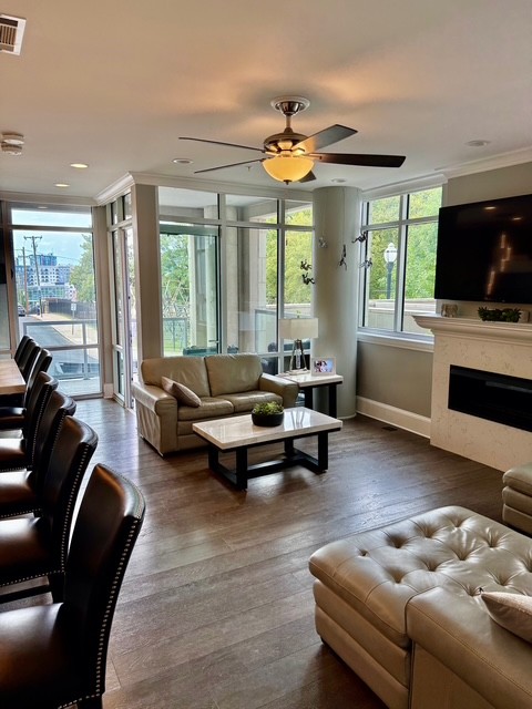 20 Rutledge Street, Unit 108 Nashville, TN 37210 - Photo 14 of 56 a living room with furniture and a flat screen tv