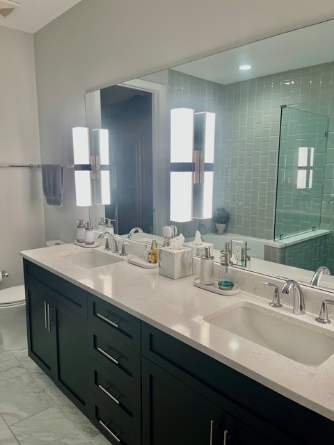 20 Rutledge Street, Unit 108 Nashville, TN 37210 - Photo 19 of 56 a bathroom with double sink and a mirror