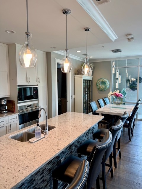 20 Rutledge Street, Unit 108 Nashville, TN 37210 - Photo 2 of 56 a view of a dining room and kitchen with a table chairs