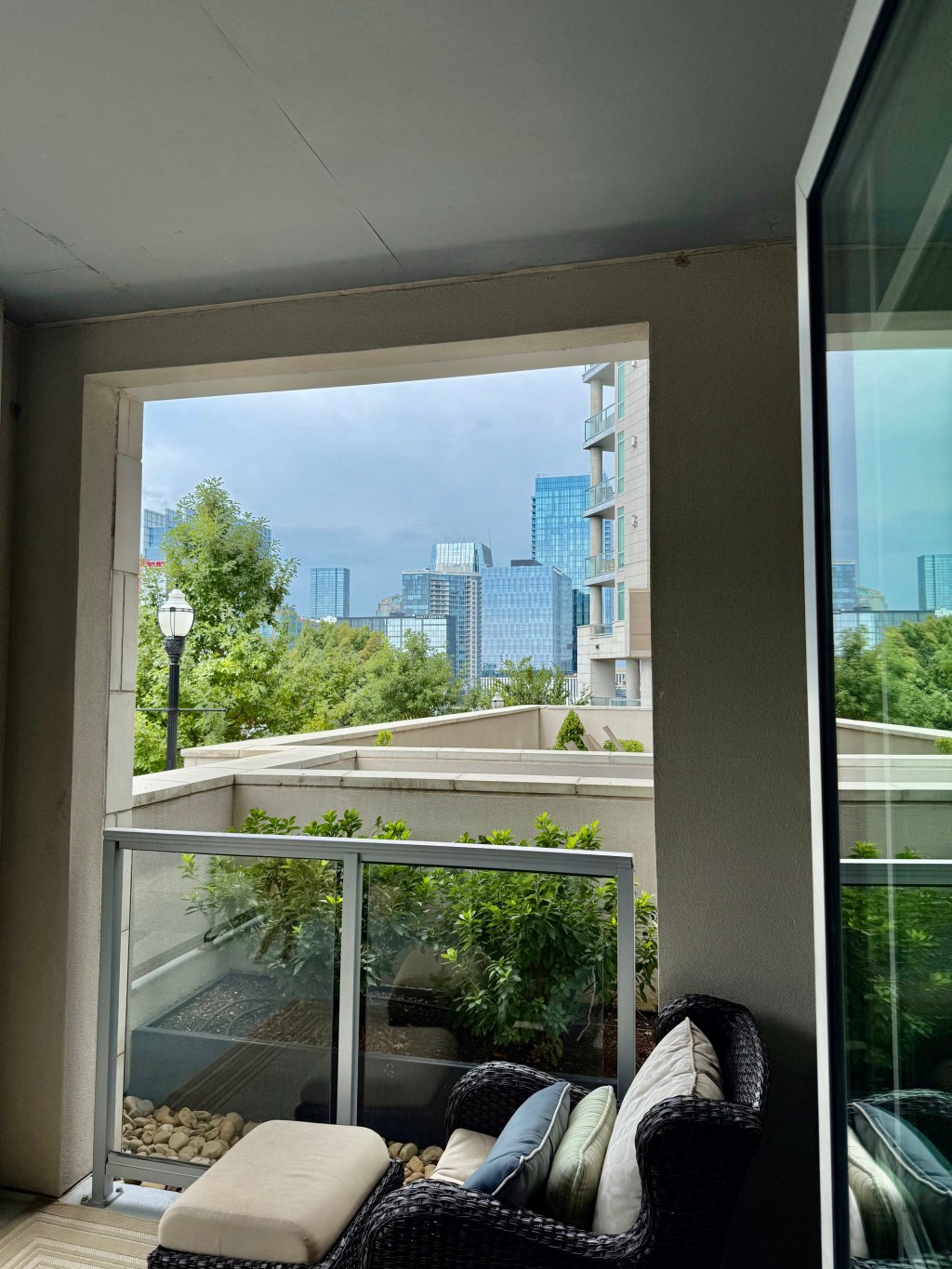 20 Rutledge Street, Unit 108 Nashville, TN 37210 - Photo 33 of 56 a view of a balcony with couches and wooden floor