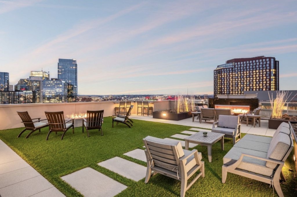 20 Rutledge Street, Unit 108 Nashville, TN 37210 - Photo 40 of 56 a view of a patio with table and chairs