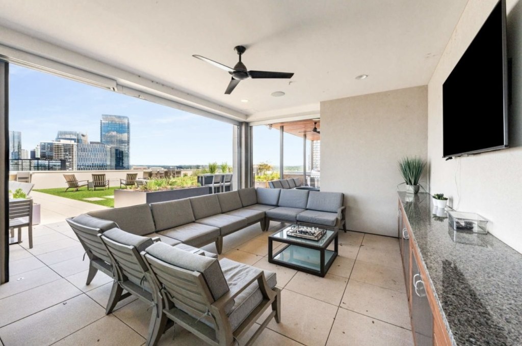 20 Rutledge Street, Unit 108 Nashville, TN 37210 - Photo 43 of 56 a living room with furniture and a flat screen tv