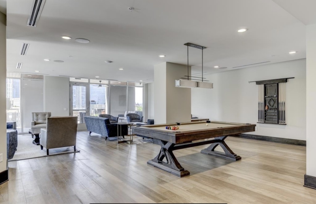 20 Rutledge Street, Unit 108 Nashville, TN 37210 - Photo 45 of 56 a room with furniture pool table wooden floor and windows