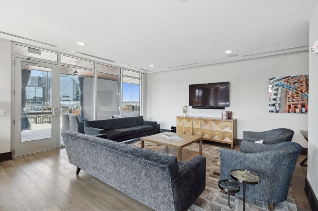 20 Rutledge Street, Unit 108 Nashville, TN 37210 - Photo 47 of 56 a living room with furniture and a flat screen tv