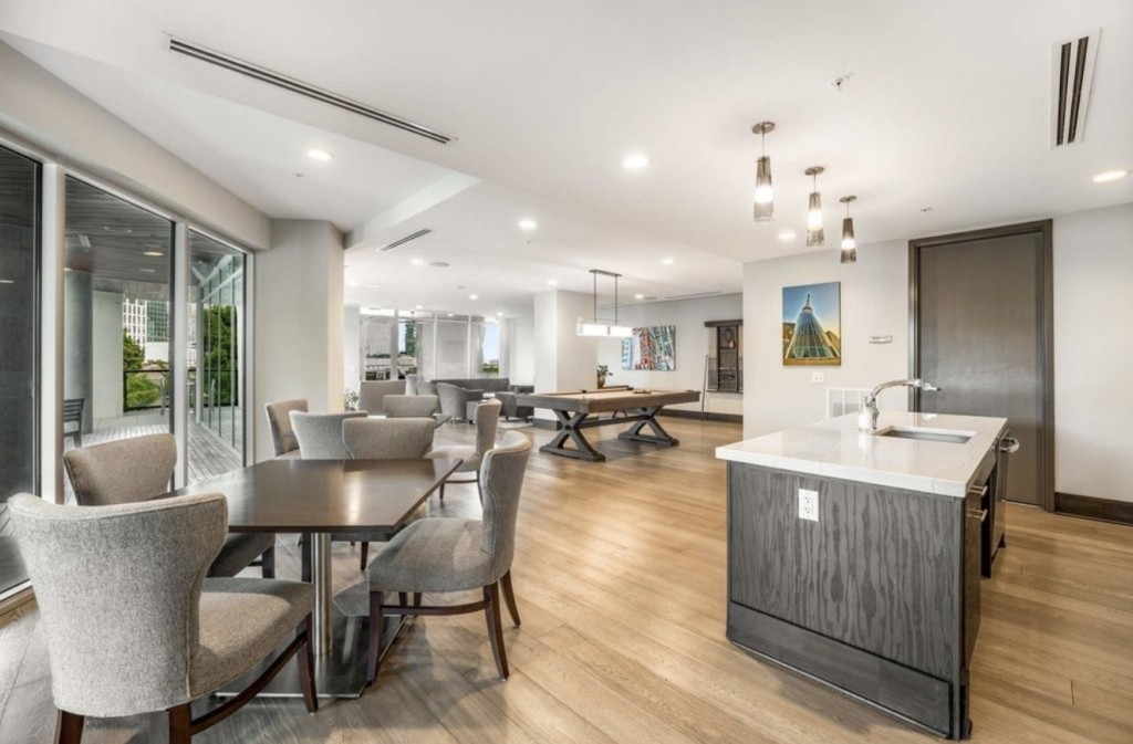 20 Rutledge Street, Unit 108 Nashville, TN 37210 - Photo 48 of 56 a dining room with furniture a rug and wooden floor