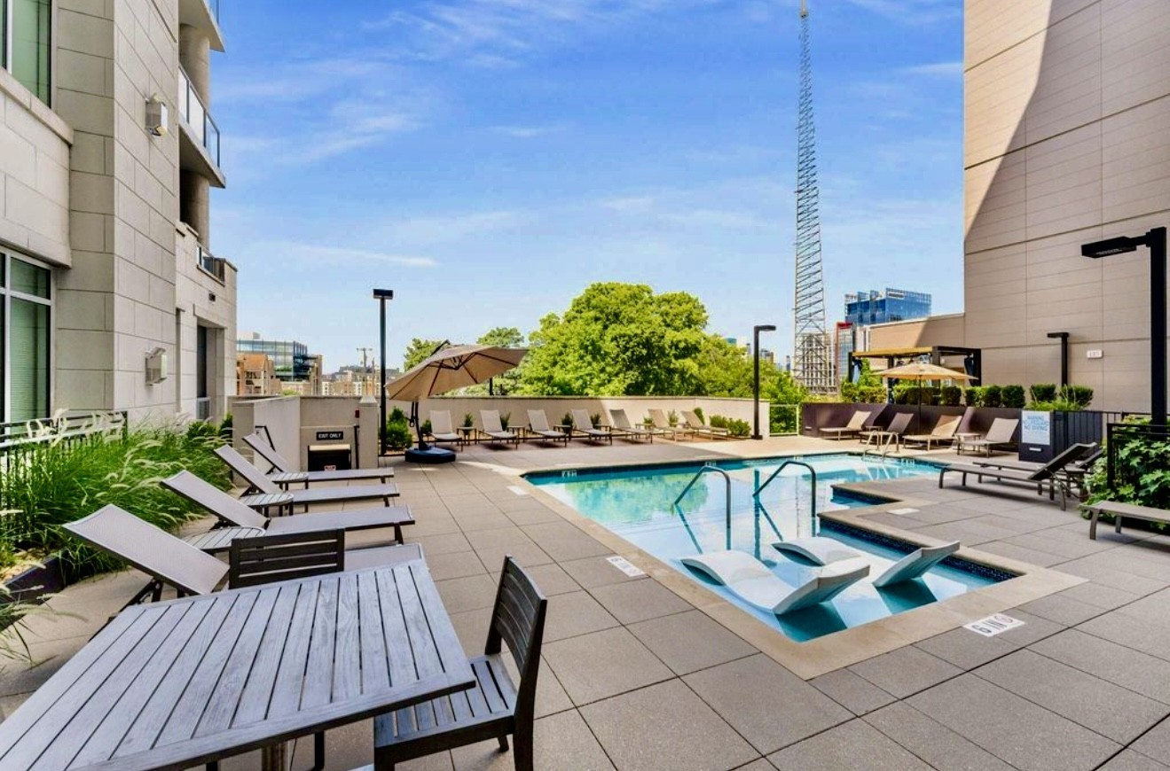 20 Rutledge Street, Unit 108 Nashville, TN 37210 - Photo 54 of 56 a view of a patio with swimming pool table and chairs