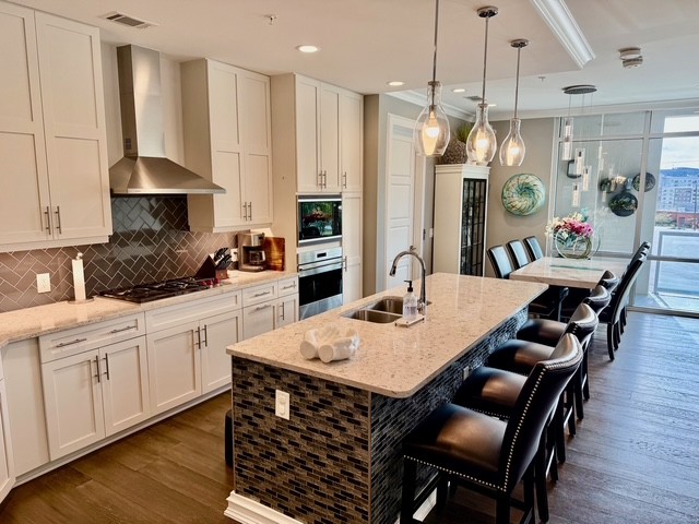 20 Rutledge Street, Unit 108 Nashville, TN 37210 - Photo 6 of 56 a large kitchen with a table and chairs