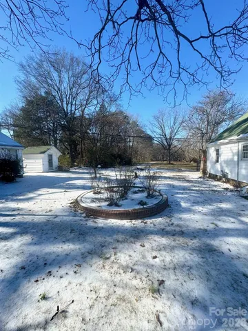a view of swimming pool with a yard