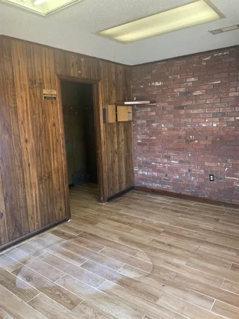 a view of a room with wooden walls