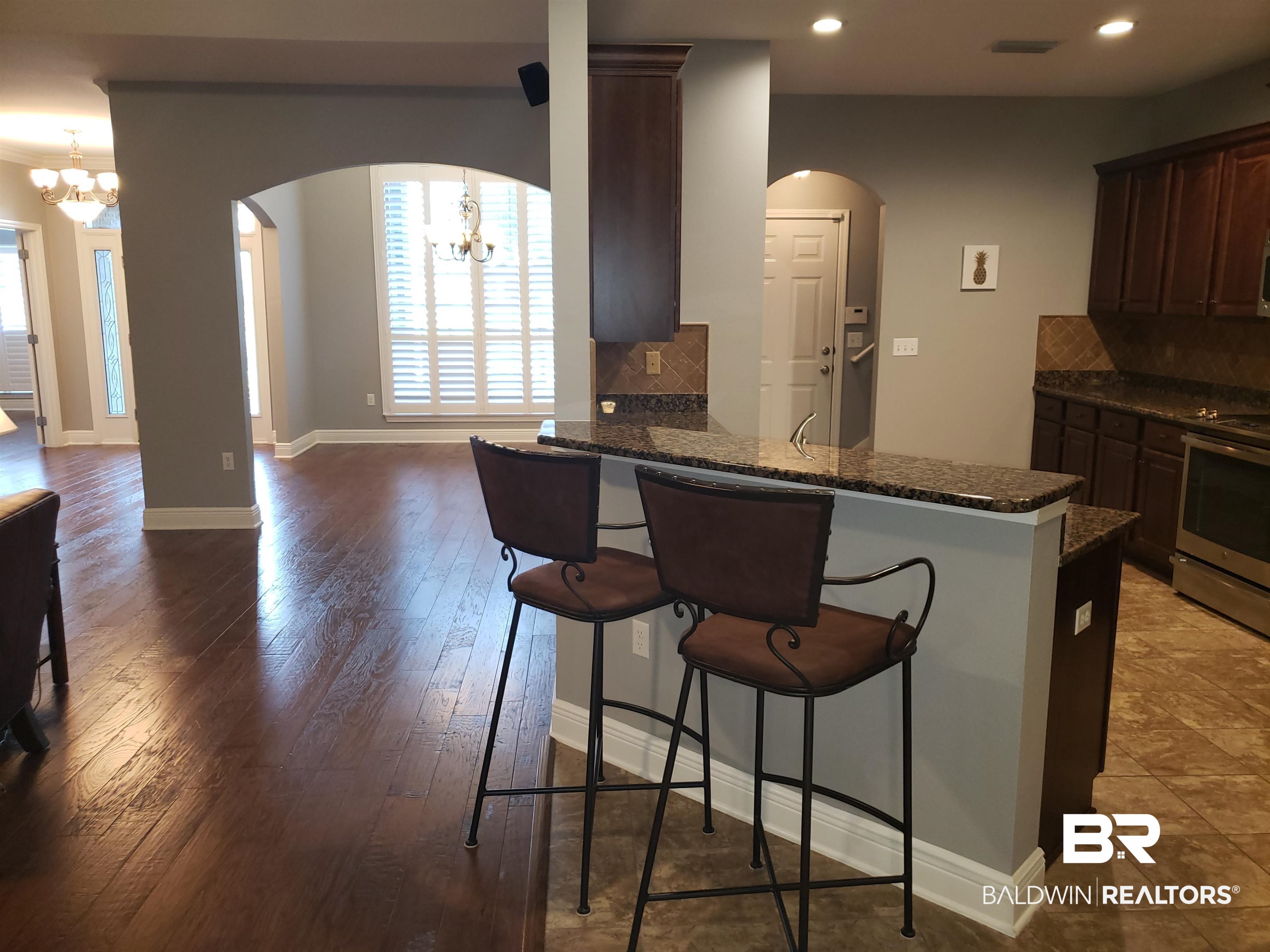 23373 Dundee Circle Foley, AL 36535 - Photo 34 of 34 Step up Bar to Kitchen and Open Floor Plan