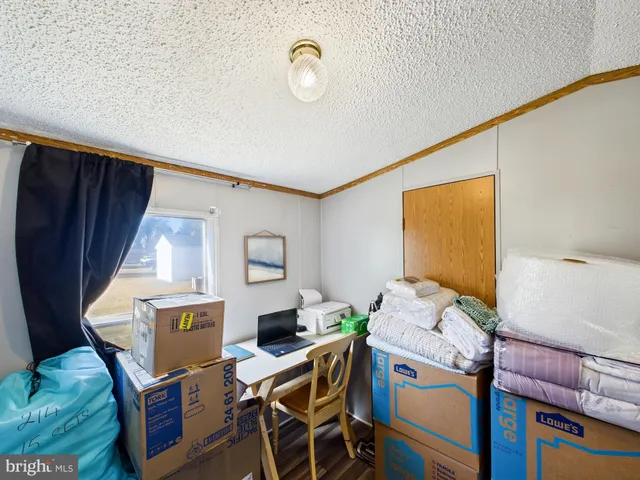 a room with a bed and a lamp