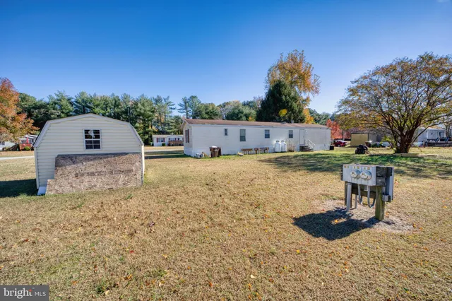 a view of a backyard with sitting area