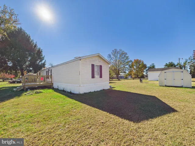 a house view with swimming pool