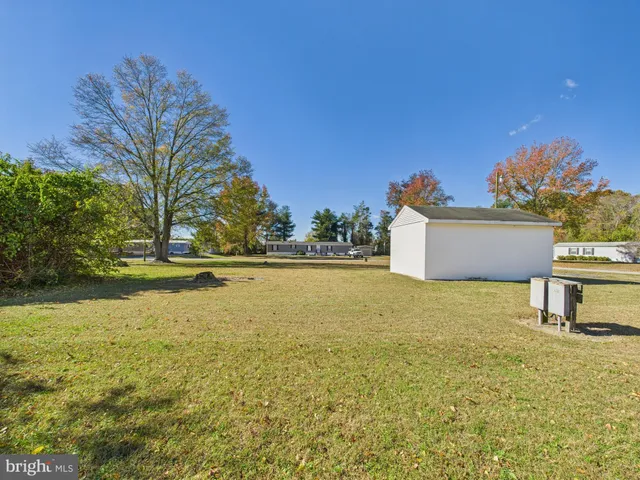 a view of a swimming pool with a yard