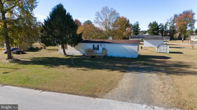 an aerial view of house with yard