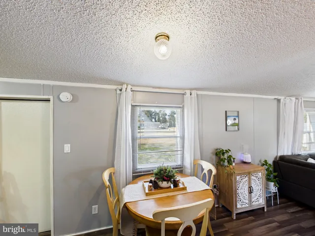 a room with furniture a rug and a window