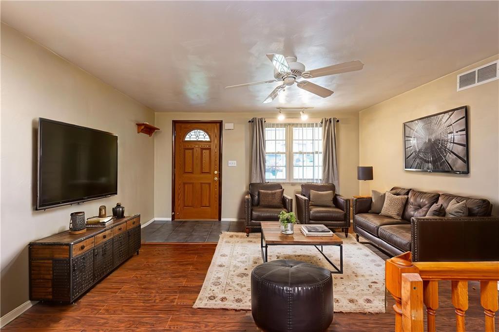 11320 James Street Irwin, PA 15642 - Photo 14 of 42 a living room with furniture and a flat screen tv