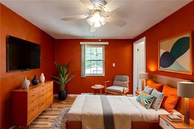 a bedroom with a bed and glass window