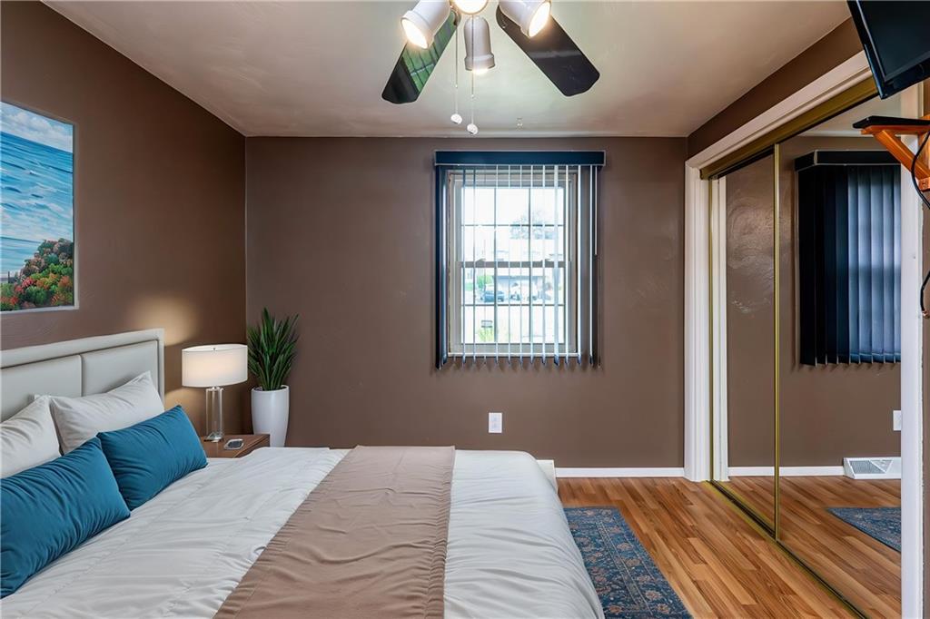 11320 James Street Irwin, PA 15642 - Photo 23 of 42 a bedroom with a bed and wooden floor