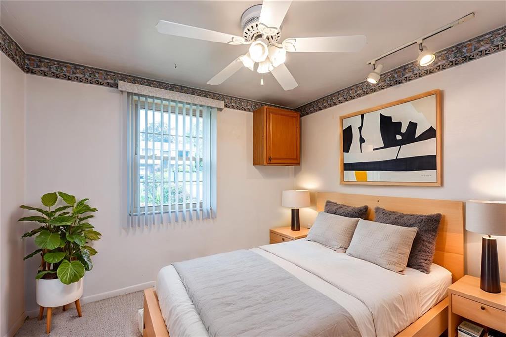 11320 James Street Irwin, PA 15642 - Photo 26 of 42 a bedroom with a bed and a chandelier