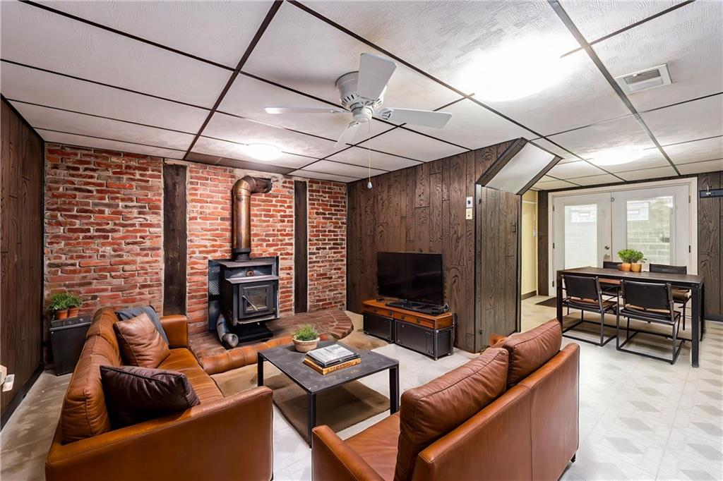 11320 James Street Irwin, PA 15642 - Photo 31 of 42 a living room with fireplace furniture and a flat screen tv