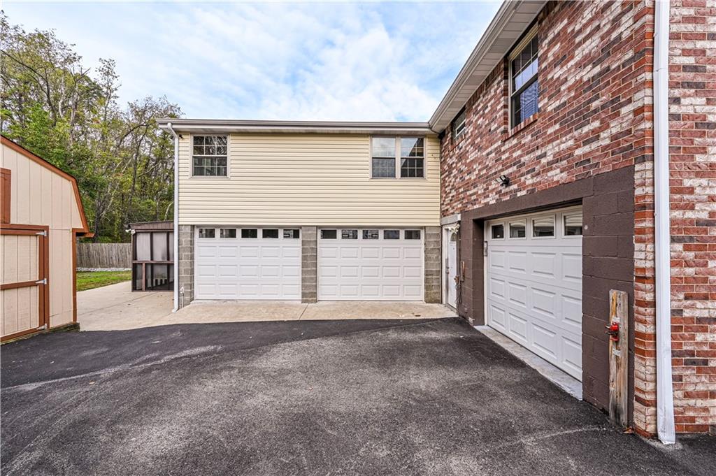 11320 James Street Irwin, PA 15642 - Photo 35 of 42 a view of a house with a garage