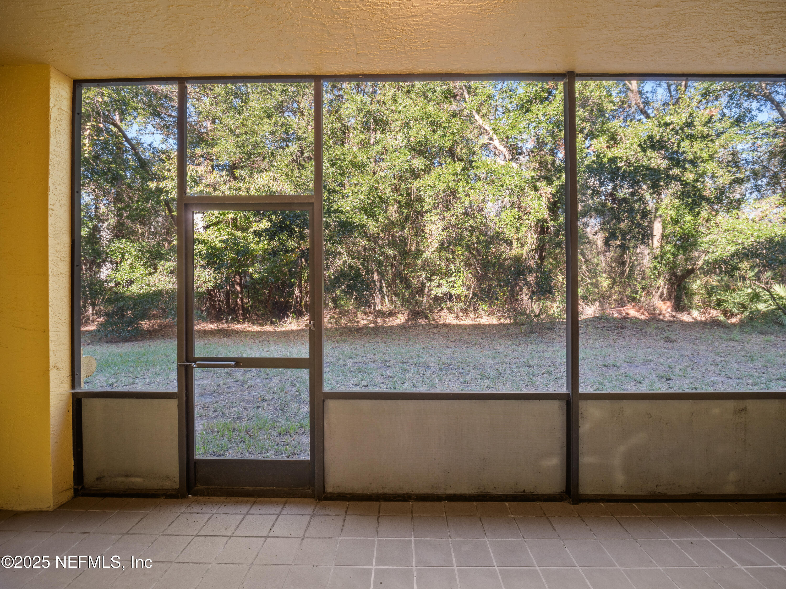 9745 Touchton Road, Unit 1204 Jacksonville, FL 32246 - Photo 18 of 35 a view of a garden from a living room