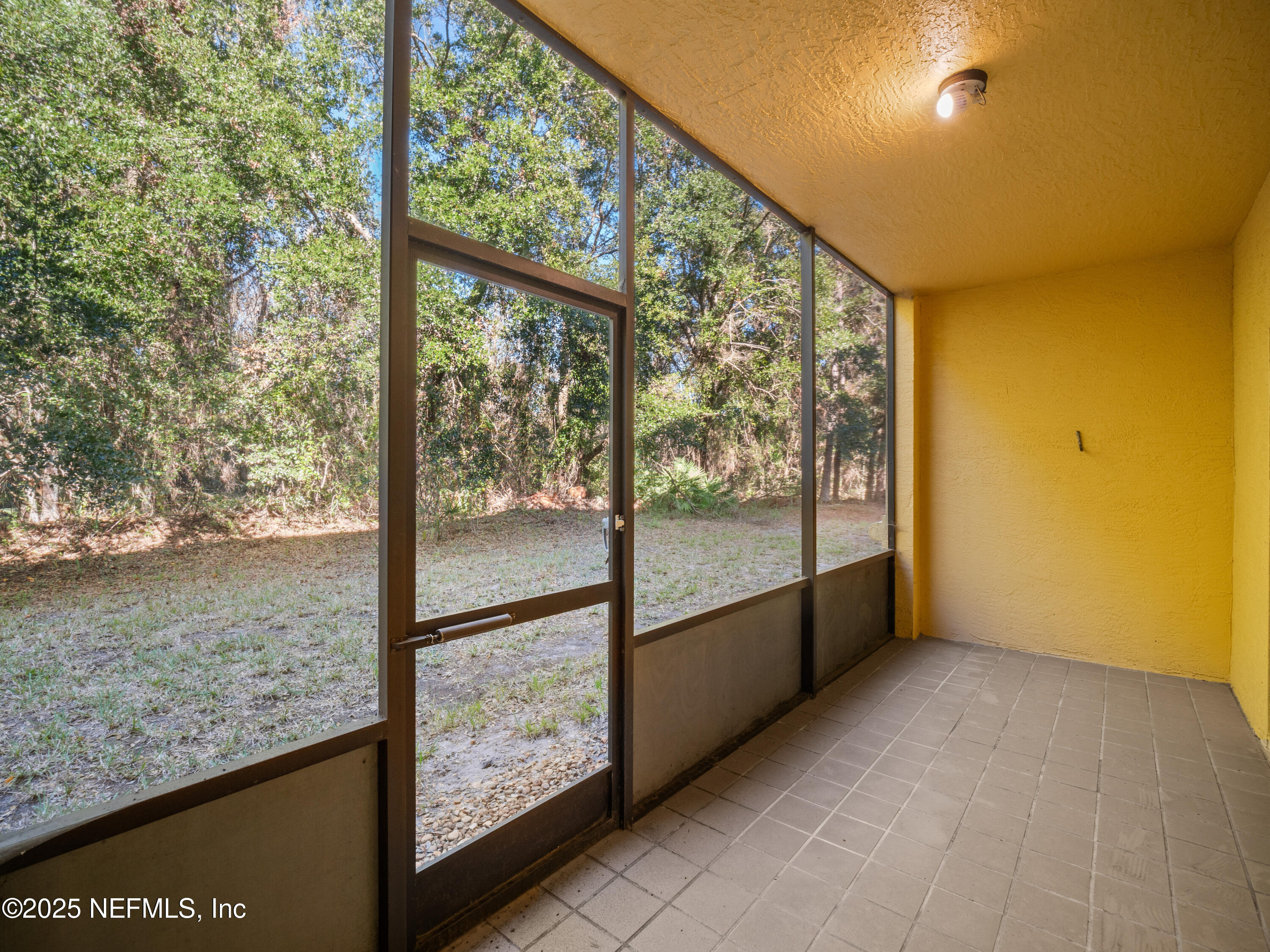 9745 Touchton Road, Unit 1204 Jacksonville, FL 32246 - Photo 19 of 35 a view of an empty room and window