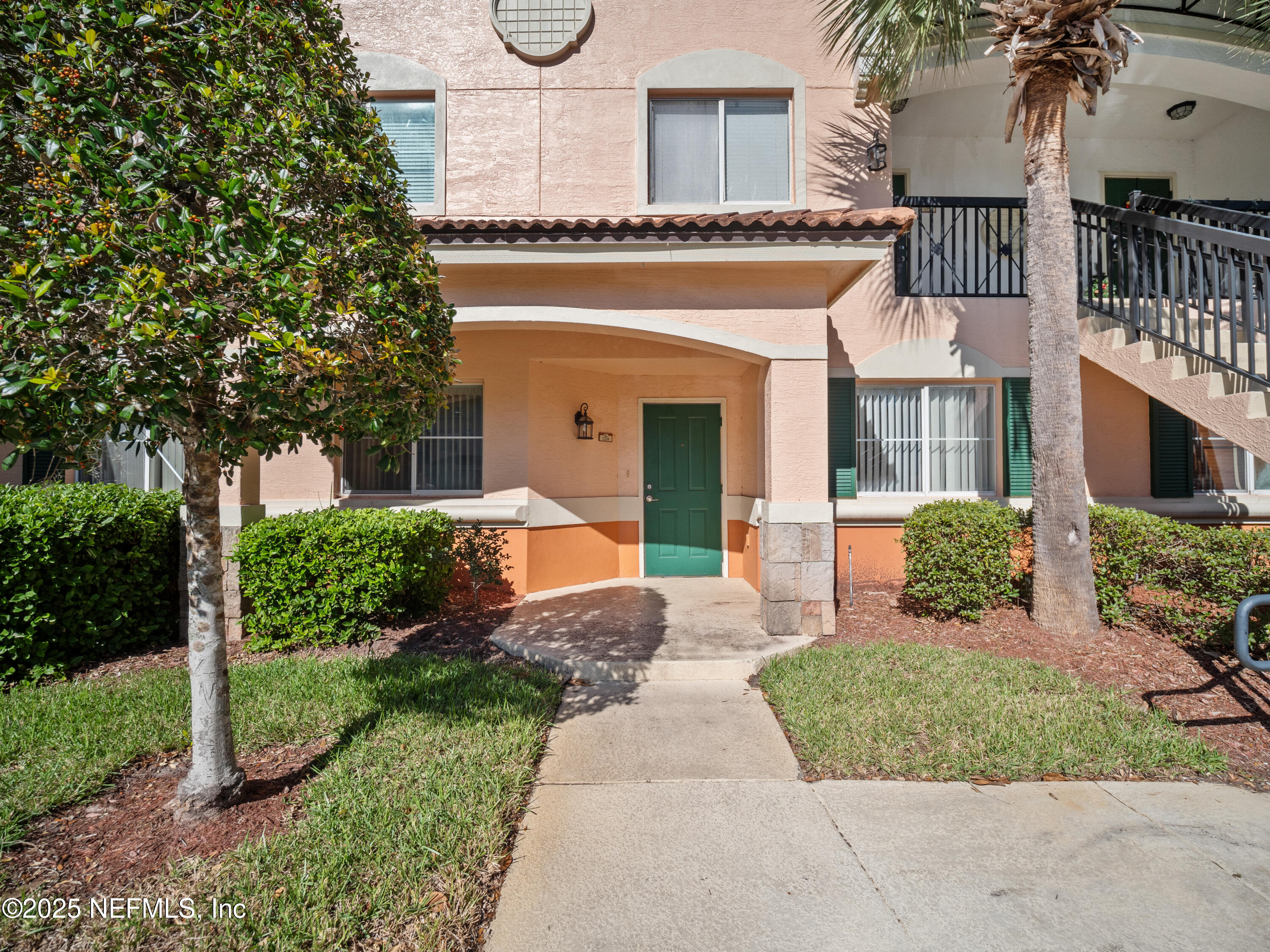 9745 Touchton Road, Unit 1204 Jacksonville, FL 32246 - Photo 2 of 35 a front view of a house with garden