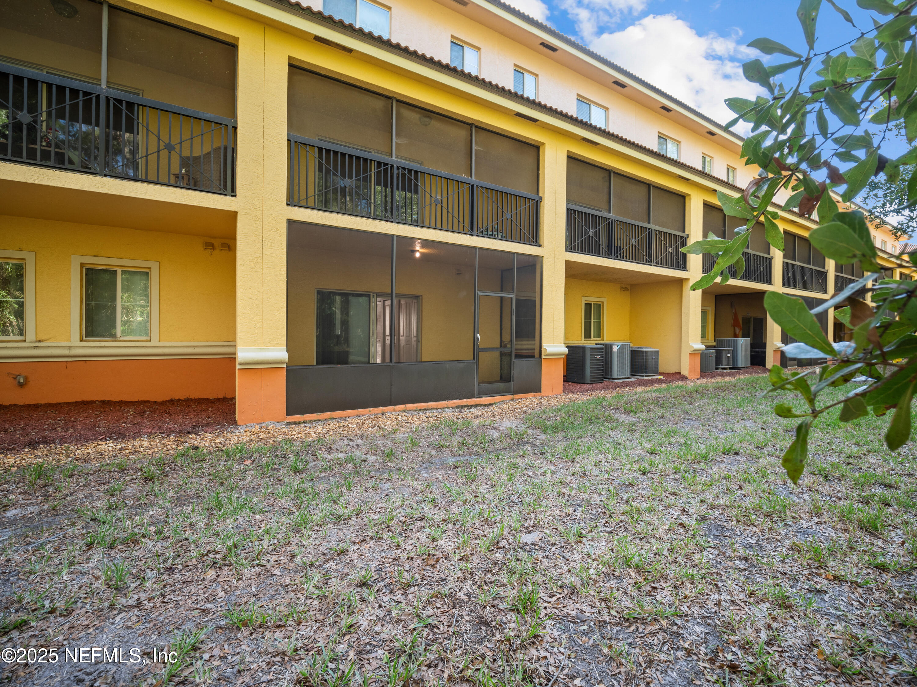 9745 Touchton Road, Unit 1204 Jacksonville, FL 32246 - Photo 21 of 35 a view of a building with a yard