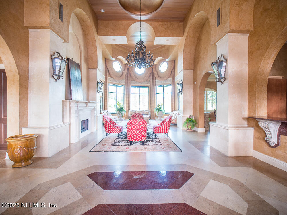 9745 Touchton Road, Unit 1204 Jacksonville, FL 32246 - Photo 24 of 35 a living room with furniture chandelier and window