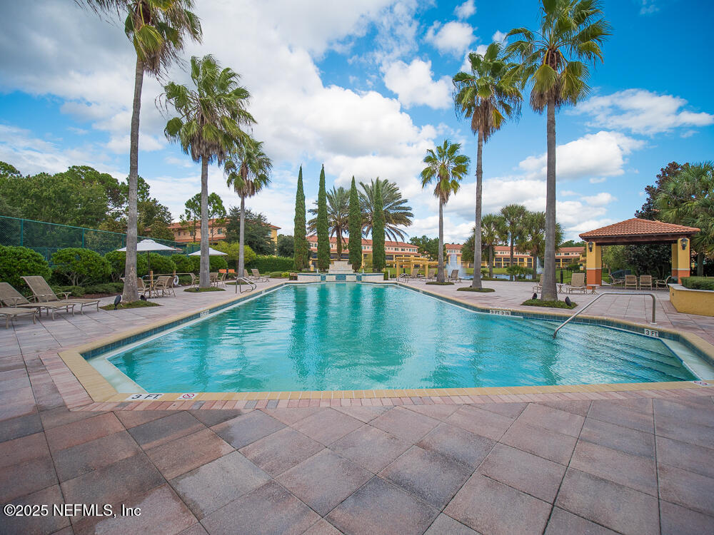 9745 Touchton Road, Unit 1204 Jacksonville, FL 32246 - Photo 29 of 35 a view of a swimming pool with a patio