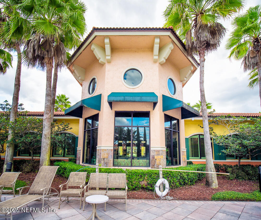 9745 Touchton Road, Unit 1204 Jacksonville, FL 32246 - Photo 30 of 35 a front view of a house with garden
