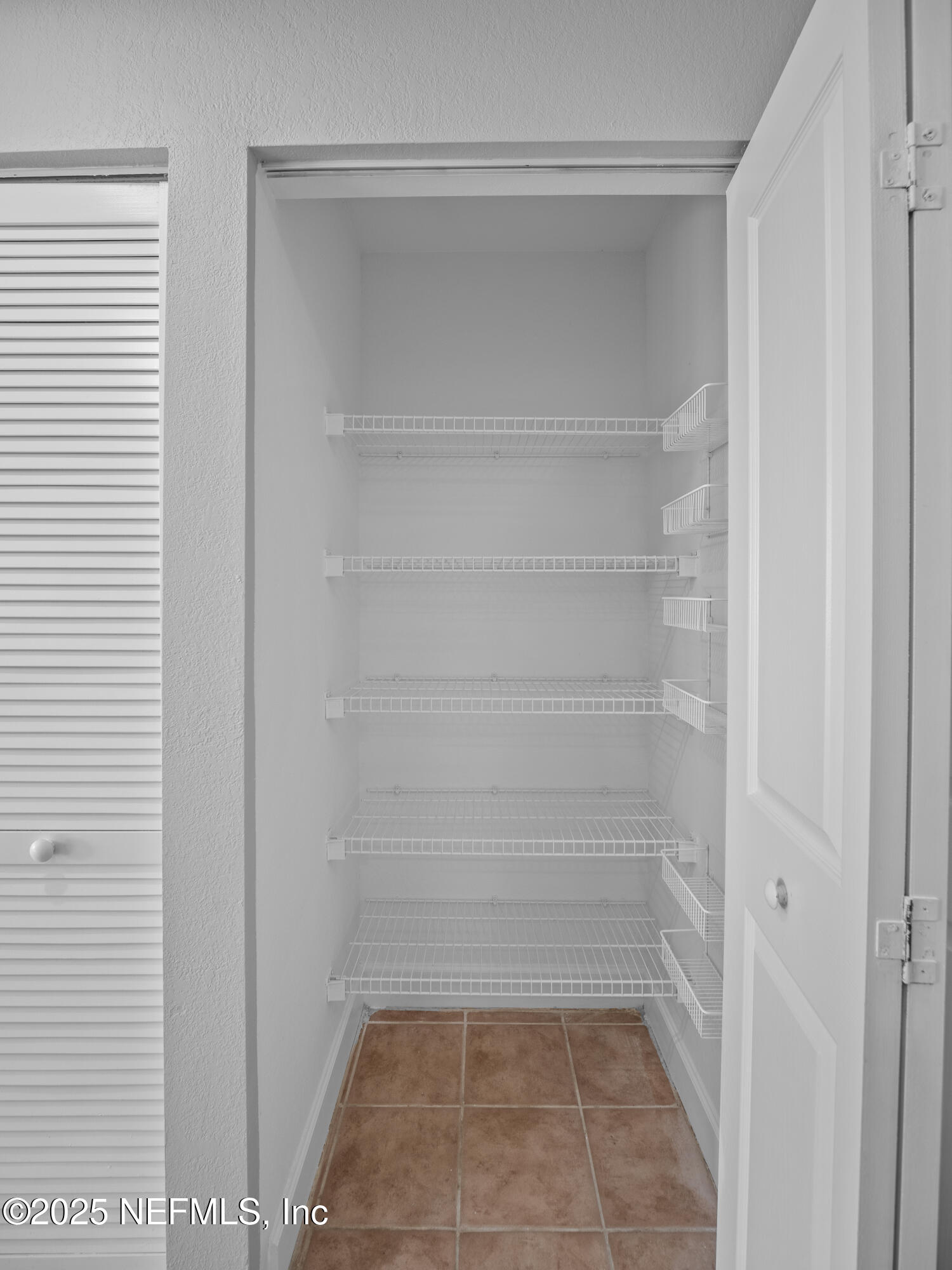 9745 Touchton Road, Unit 1204 Jacksonville, FL 32246 - Photo 7 of 35 a view of a room with white walls