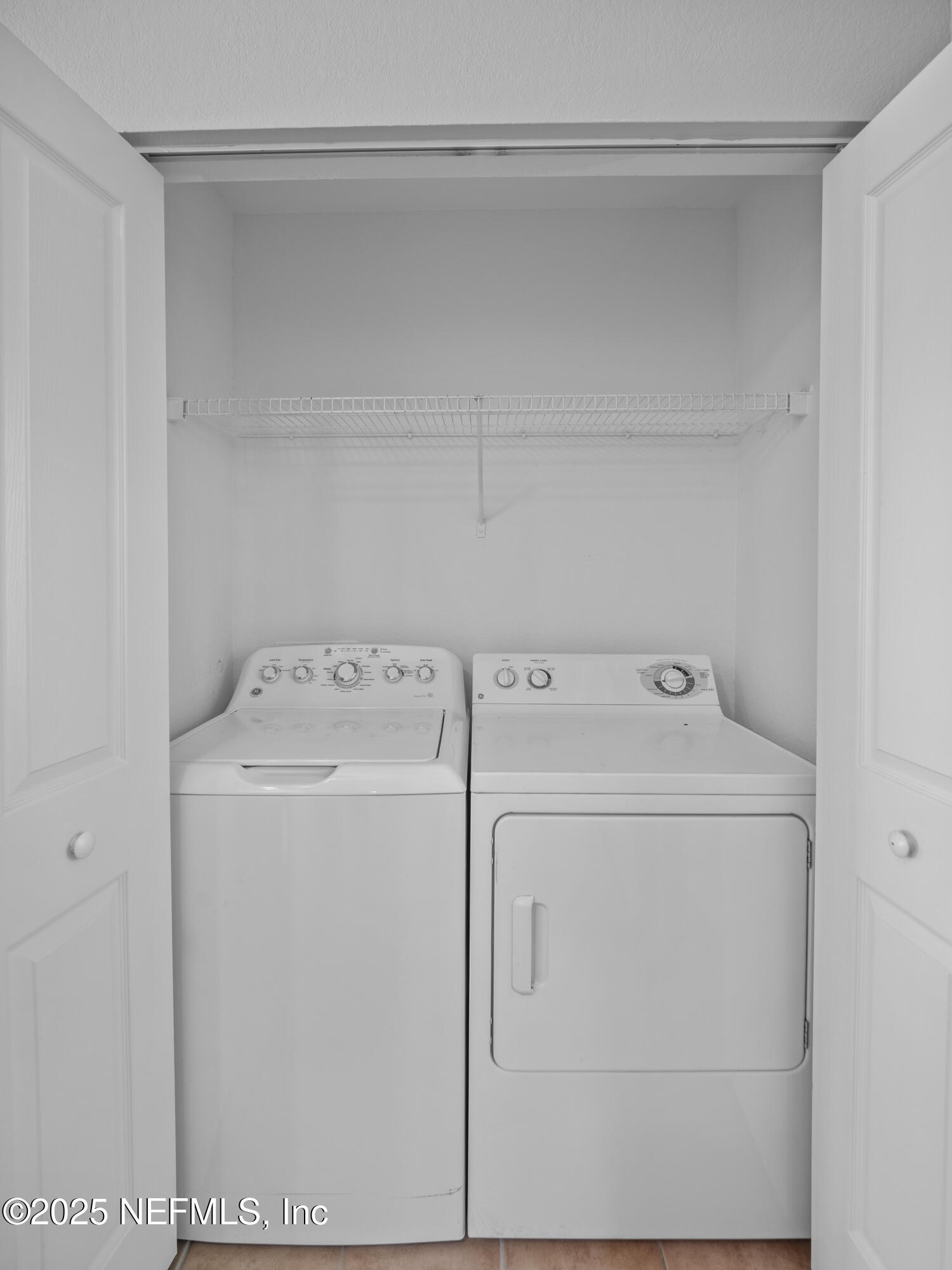 9745 Touchton Road, Unit 1204 Jacksonville, FL 32246 - Photo 8 of 35 a utility room with dryer and washer