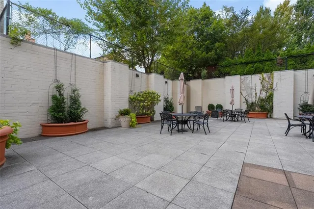 a view of a backyard with sitting area and furniture