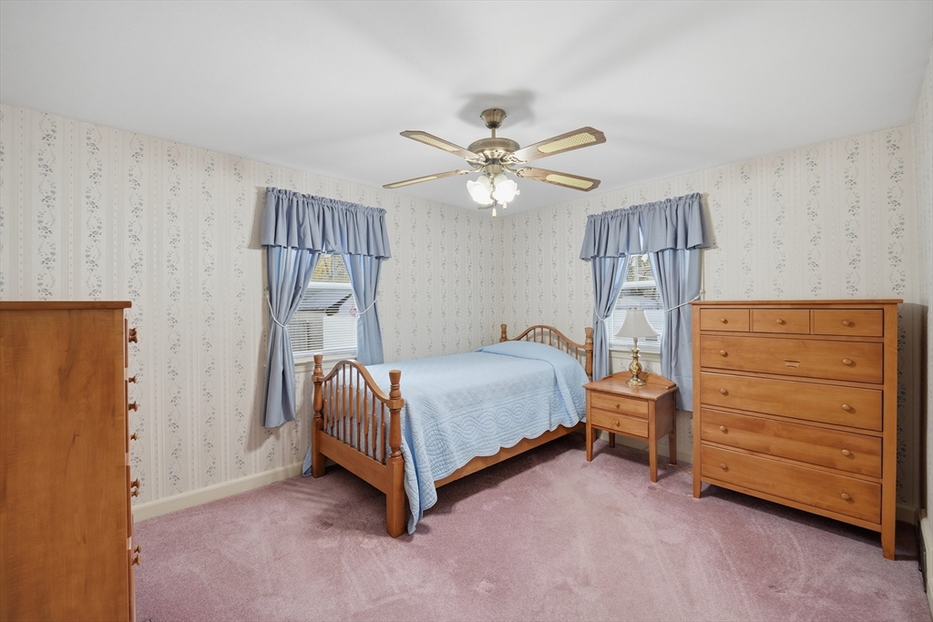 246 El Paso Street Springfield, MA 01104 - Photo 12 of 29 a bedroom with a bed and a ceiling fan
