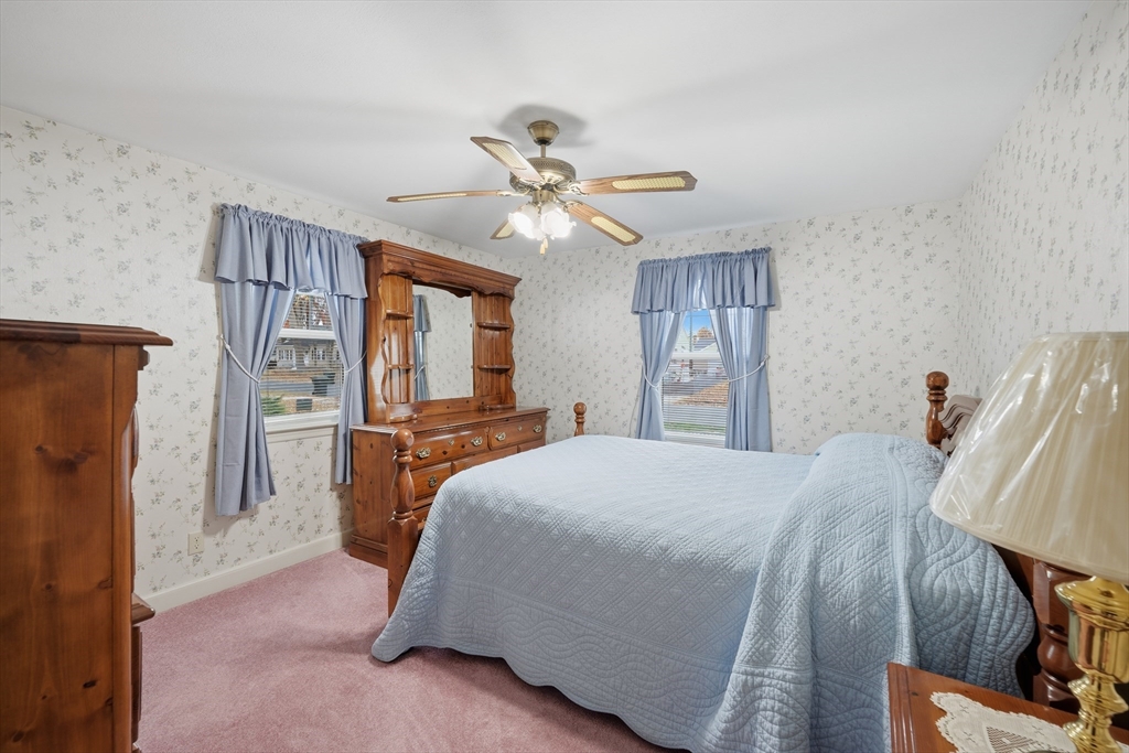 246 El Paso Street Springfield, MA 01104 - Photo 15 of 29 a bedroom with a bed and a refrigerator