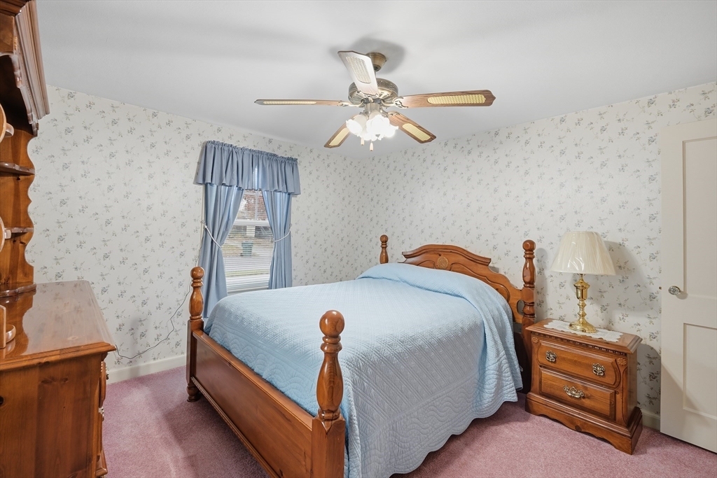 246 El Paso Street Springfield, MA 01104 - Photo 16 of 29 a bedroom with a bed and a chandelier