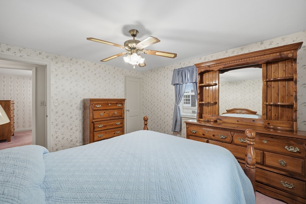 246 El Paso Street Springfield, MA 01104 - Photo 17 of 29 a bedroom with a bed and a dresser