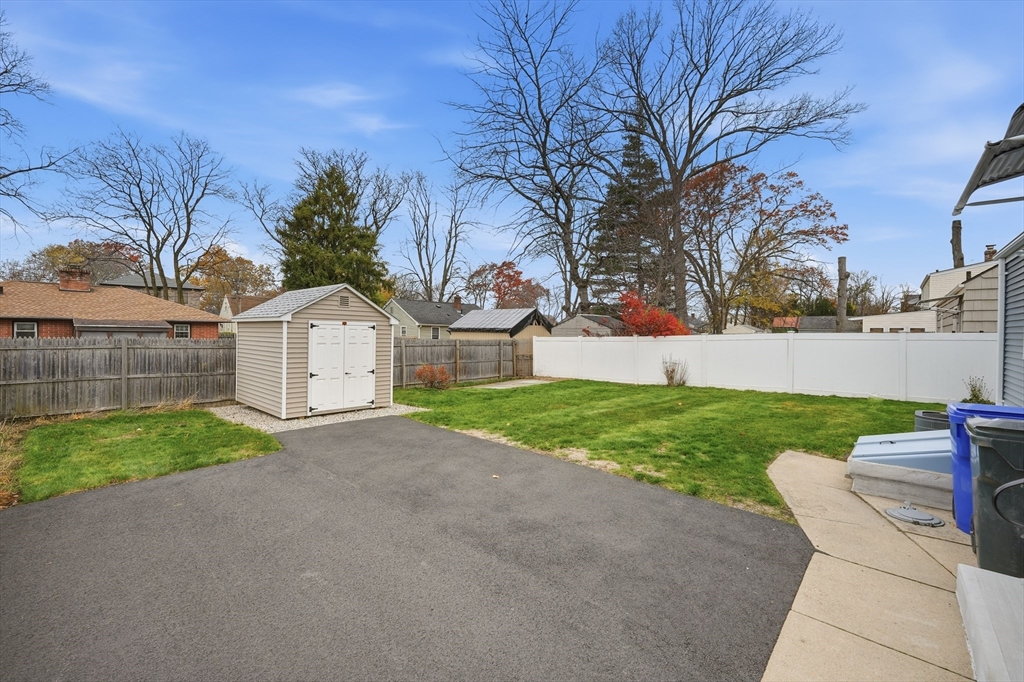 246 El Paso Street Springfield, MA 01104 - Photo 21 of 29 a view of a house with a yard and garage
