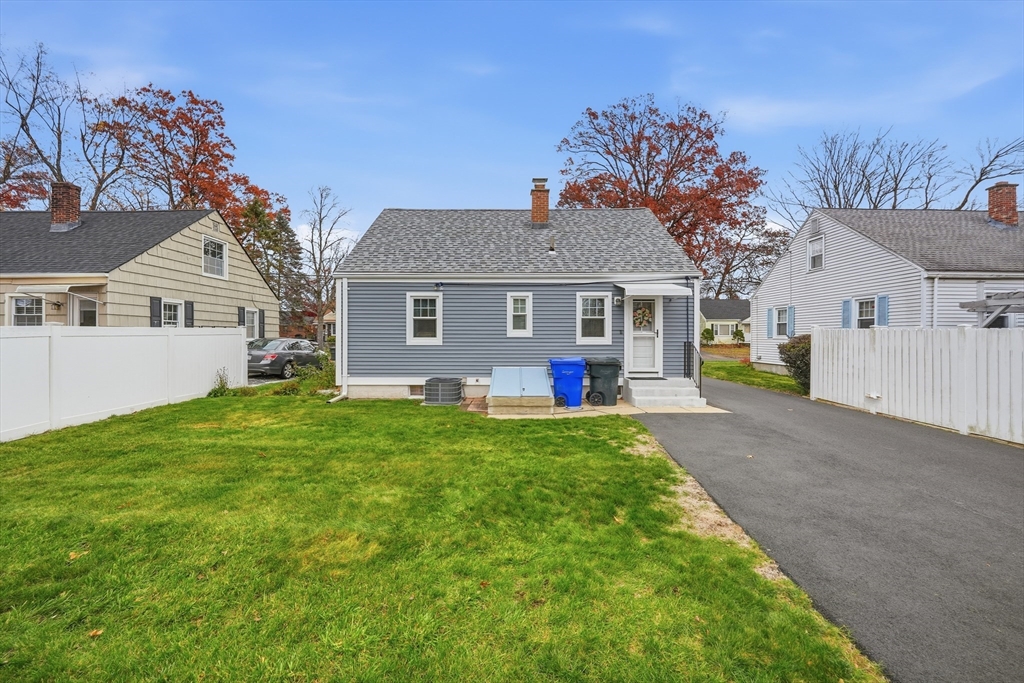 246 El Paso Street Springfield, MA 01104 - Photo 22 of 29 a front view of a house with a yard and garage