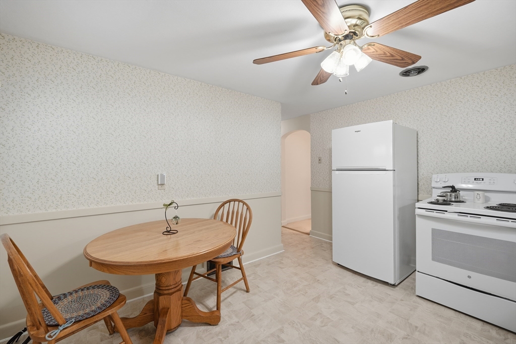 246 El Paso Street Springfield, MA 01104 - Photo 3 of 29 a view of a room that has a table and chairs in it